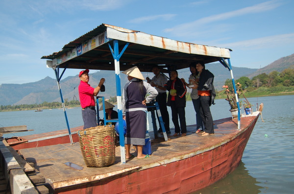 Crossing the Mekong, pointy hats abound