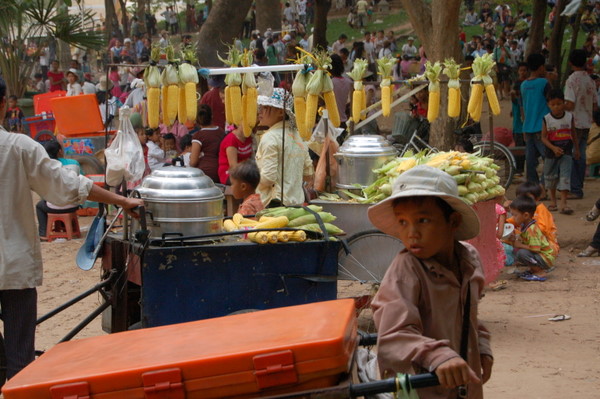 Kid selling drinks from a big orange crate